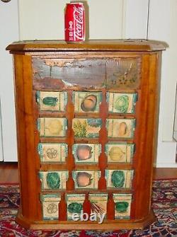 Antique L. L. May country store seed display case cabinet with product-15639