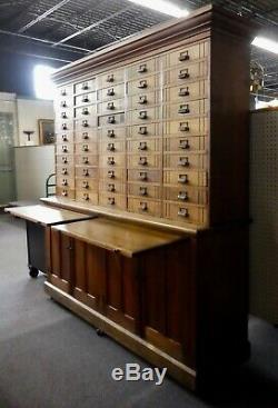 Antique Store Display Cabinet. 50 drawers. 4 Shelves. 2 Work Boards. 79.5Hx78W