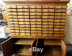 Antique Store Display Cabinet. 50 drawers. 4 Shelves. 2 Work Boards. 79.5Hx78W