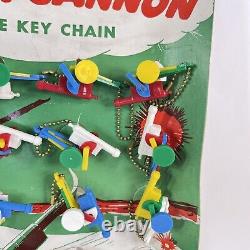 FANTASTIC VINTAGE ACTION CANNON KEYCHAIN PUZZLE STORE DISPLAY NEW UNUSED With CASE