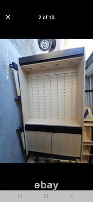 Large eyeglass display case with lights. 51 wide x 16 deep x 90 tall
