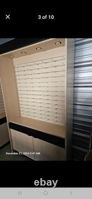 Large eyeglass display case with lights. 51 wide x 16 deep x 90 tall