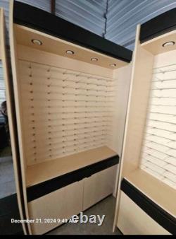 Large eyeglass display case with lights. 51 wide x 16 deep x 90 tall