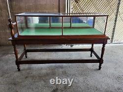 Vintage 1900 General Store Display Case on table stand 77inch long x 30inch wide